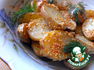 Рецепт Молодой картофель, запеченный с чесноком и кунжутом со сметанным соусом