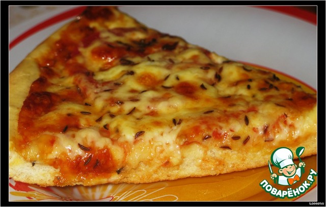 Pizza with two kinds of cheese and cumin